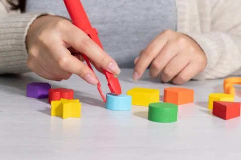 Hands using tweezers Stock Photos