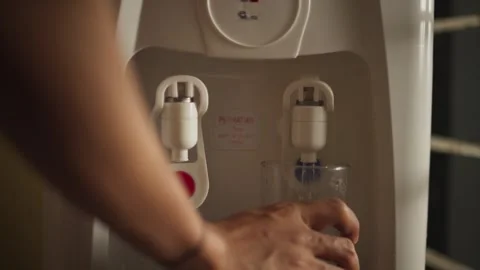 Hands Using Water Dispenser Button Close Up Stock Footage 344235973
