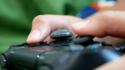 Hands using wireless game controller Stock Footage 88696193