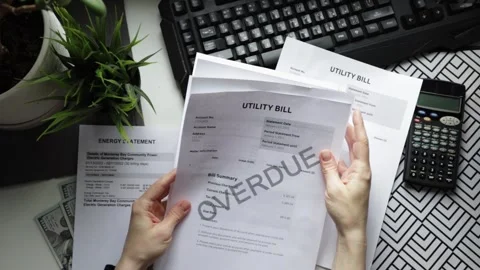 Hands with utility bills top view, tax and penalties reminder, economy and .. Stock Footage 304135129