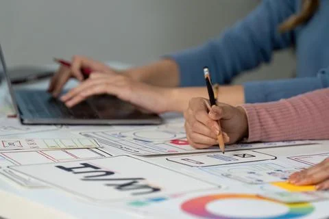 Hands on UX and UI design process with sketches and laptop Stock Photos