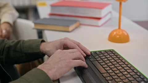 Hands of Visually Impaired Person Using Computer Keyboard with Braille Display Stock-Footage 327455887