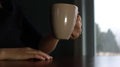 Hands warm up on hot mug Stock Footage 62944382