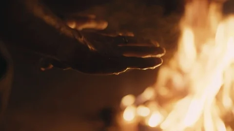 Hands warms up by fire Stock Footage 91031456