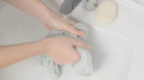 Hands wash clothes in the sink. Stock Footage 58217110
