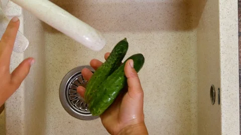 Hands wash cucumbers Stock Footage 113194294