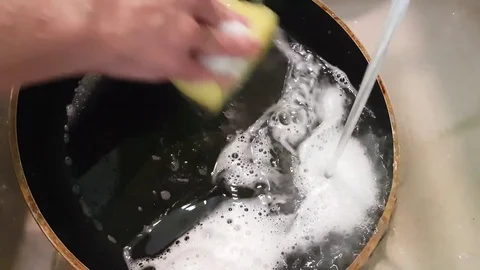 Hands wash the pan Stock Footage 80428881