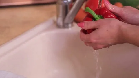 Hands wash pepper Stock Footage 100986658