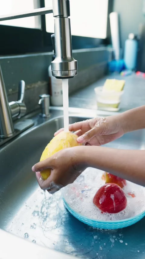 Hands Washing Fruit in Kitchen Sink, Hand Washing, Mango, Apple, Disinfectin Stock Footage 277222144