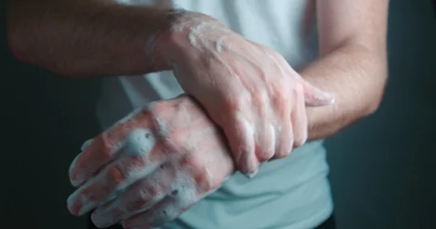 Hands washing by a man slow motion 4K Stock Footage 127930563