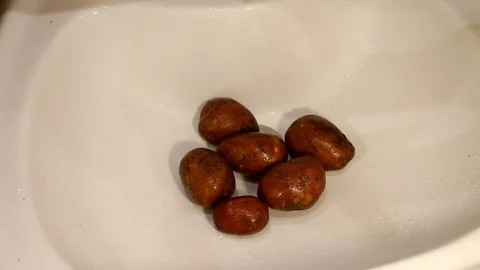 Hands washing potatoes. Man washes potatoes Stock Footage 87554072