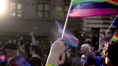 Hands waving LGBT rainbow flags Gay Pride Parade in NYC 스톡 동영상 64959000