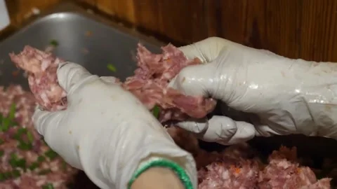 Hands Wearing White Gloves Preparing Raw Ground Meat Mix With Vegetables Video stock 343588297