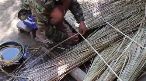 Hands Weaving Thatch Construction Material Stock Footage 26084842