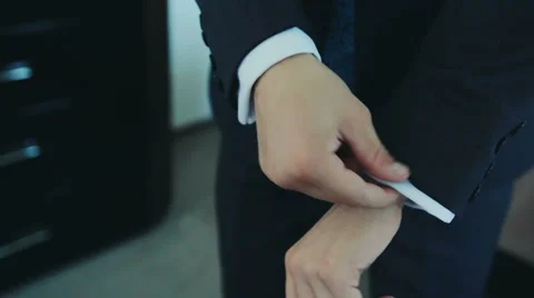 Hands of wedding groom getting ready in suit Stock Footage 60582148