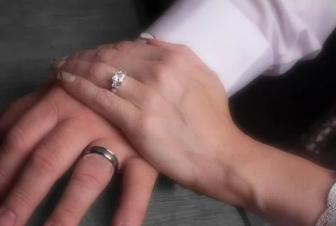 Hands with wedding rings Stock Photos