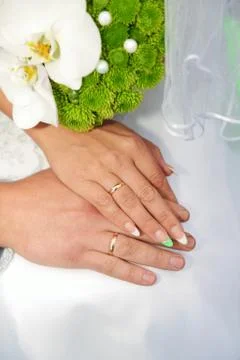 Hands with wedding rings Stock Photos