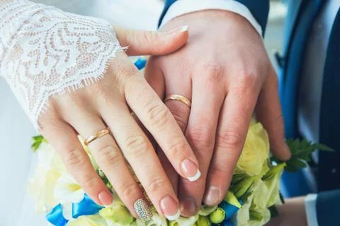 Hands with wedding rings Stock Photos