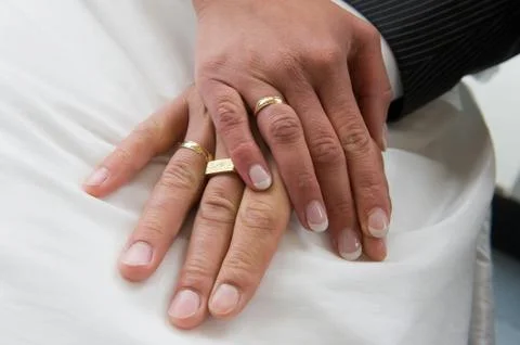 Hands with wedding rings Stock Photos