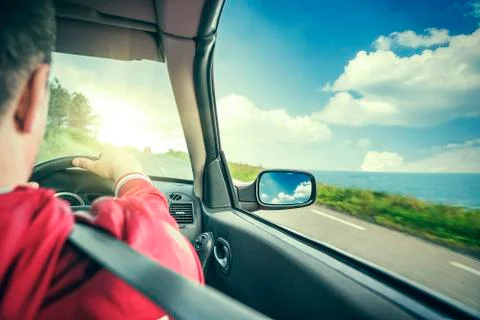 Hands on wheel of a car. Stock Photos