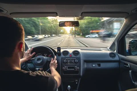 Hands on the wheel when driving at high speed from inside the car. Foto stock