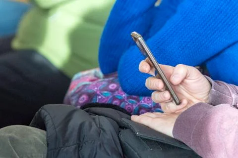 Hands while texting on cellular smartphone detail Stock Photos