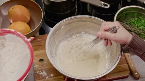 Hands Whisking Cake Batter and Sifting Flour for Baking Stock Footage 339446689