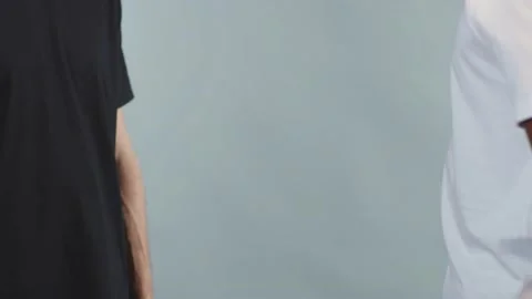 Hands white and black men shake hands stop racism all people are equal Stock Footage 133639488