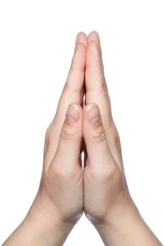 Hands on a white background folded in prayer Stock Photos