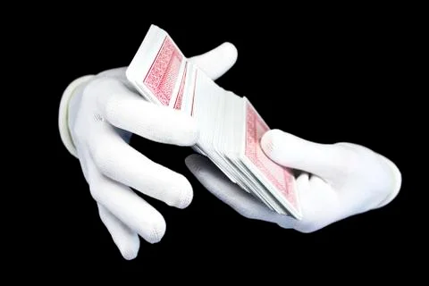 Hands in white gloves with a pack of playing cards 스톡 사진
