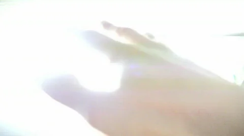 Hands in white light Video stock 725592