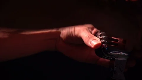 Hands of a white man turn and correct vintage glare microphone on scene close up Stock Footage 118529068