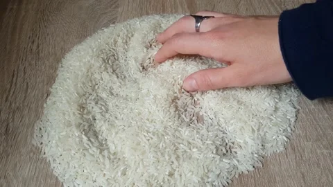 Hands On White Rice Background Stock Footage 137907108