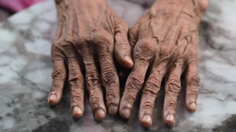 Hands of wisdom rest on the marble surface Stock Footage 339120401