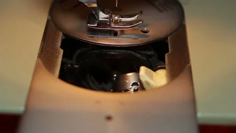 Hands of woman inserting thread into sewing machine to sew medical mask Stock-Footage 130844164