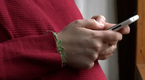 Hands of woman sending message using mobile phone Stock Footage 60576485