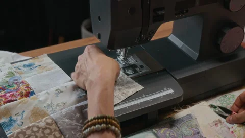 Hands of Woman Stitching Patchwork Squares on Sewing Machine Stock Footage 315763634