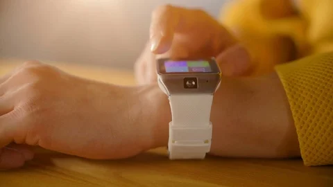 Hands of woman using her modern smart watches Stock Footage 69971377