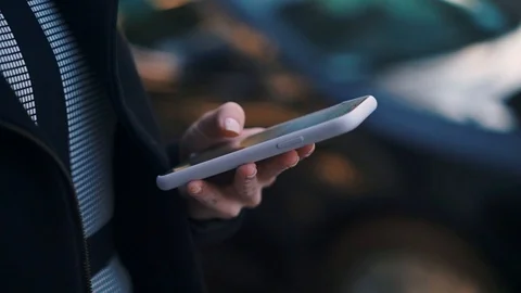 Hands of woman using smartphone outside Stock Footage 115250071