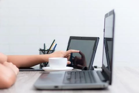 Hands of woman using table on wooden table Stock Photos