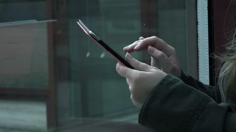 Hands of woman using tablet computer with reflection on the window  Video stock 56239639