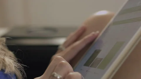 Hands of a woman using a tablet to work Stockbeeldmateriaal 59327349