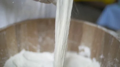 Hands of woman working in a bakery, making fresh handmade spaghetti or pasta Stock Footage 71391840