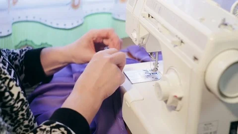 Hands of a woman working with a sewing machine. Video stock 73045214