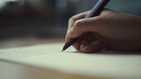 Hands of a woman writing on a piece of paper. Writing love lettersHand writing Stock Footage
