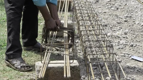 Hands at Work - Constructing a Foundation with Steel 스톡 동영상 324030572