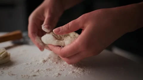 Hands work dough in flour dust Video stock 336051022