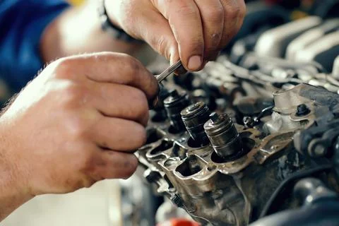 Hands work on engine parts 스톡 사진