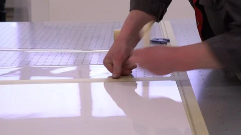 Hands. Work as hands. The worker sticks openings on a printer desktop Video stock 88396578