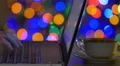The hands work with laptop: type text. Cute varicolored bokeh background 4k or 4k+ Resolution
